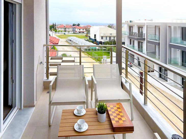 Sea View Terrace Second Floor Sea view terrace at Thálassa Blu Family Maisonette in Nikiti Chalkidiki Greece outdoor seating with panoramic Aegean Sea views